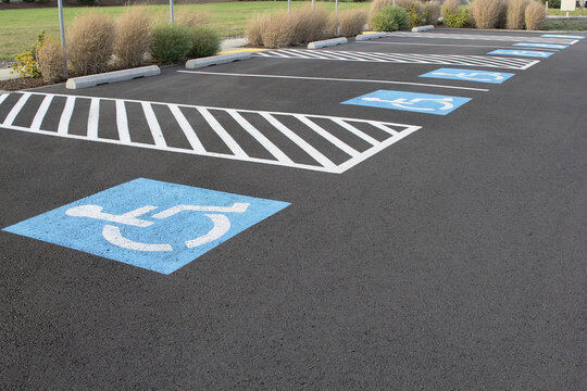 ADA-compliant handicap parking spaces with access aisles and blue handicap symbols