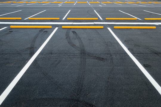 Freshly re-striped commercial parking lot with bright white and yellow lines